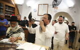 A Jewish man blows a shofar in Meron, northern Israel, on August 9, 2021, ahead of the Jewish New Year. (David Cohen/Flash90)