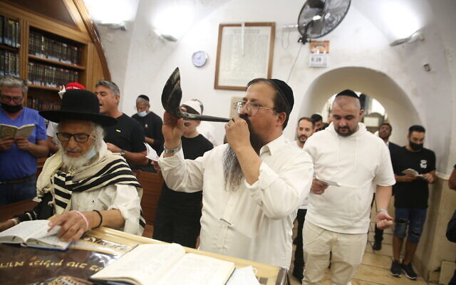 A Jewish man blows a shofar in Meron, northern Israel, on August 9, 2021, ahead of the Jewish New Year. (David Cohen/Flash90) A Jewish man blows a shofar in Meron, northern Israel, on August 9, 2021, ahead of the Jewish New Year. (David Cohen/Flash90)