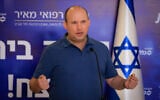 Prime Minister Naftali Bennett speaks ahead of receiving his third COVID-19 vaccine shot at Meir Medical Center in Kfar Saba, on August 20, 2021. (Olivier Fitoussi/Flash90)