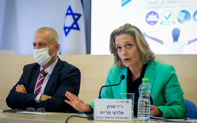 Dr. Sharon Alroy-Preis (right), head of public health services at the Health Ministry, at a press conference in Jerusalem on August 29, 2021, alongside Nachman Ash, director-general of the Health Ministry. (Olivier Fitoussi/Flash90)