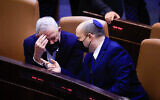 Prime Minister Naftali Bennett and Defense Minister Benny Gantz speak in the Knesset on September 2, 2021. (Olivier Fitoussi/ Flash90)