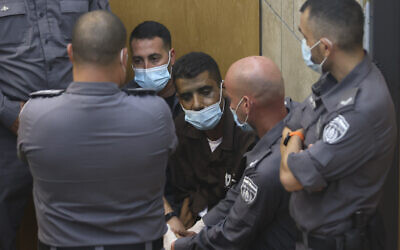 Zakaria Zubeidi, a notorious Fatah terrorist recaptured after breaking out of Gilboa Prison with five other security prisoners, arrives for a hearing at the District Court in Nazareth, on September 11, 2021. (David Cohen/Flash90)