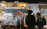 Police outside a precarious-looking sukkah in Jerusalem slated for demolition, on September 12, 2021. (Olivier Fitoussi/Flash90)