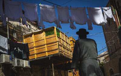 A sukkah in the ultra-Orthodox neighborhood of Mea Shearim in Jerusalem on September 19, 2021 (Olivier Fitoussi/Flash90)