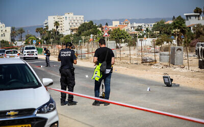 Security forces at the scene where a driver rammed two police officers, killing one of them, in the northern Israeli city of Nahariya, September 21, 2021 (Alon Nadav/Flash90)