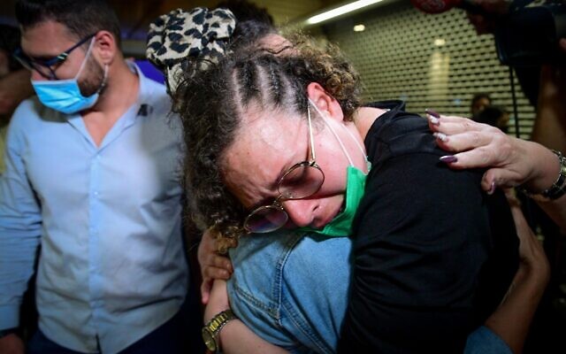 Hodaya Monsonego, an Israeli woman who was jailed in Peru, is greeted by relatives upon her arrival at Ben Gurion Airport on September 24, 2021. (Avshalom Sassoni/Flash90) Hodaya Monsonego, an Israeli woman who was jailed in Peru, is greeted by relatives upon her arrival at Ben Gurion Airport on September 24, 2021. (Avshalom Sassoni/Flash90)
