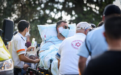 Reuven Ben-Eli, the father who was severely wounded in a traffic accident, arrives at the funeral of his wife and three children in Ma'alot-Tarshiha, on September 30, 2021. (David Cohen/Flash90)