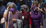 People wearing face masks shop at the Mahane Yehuda market in Jerusalem, on September 29, 2021. (Olivier Fitoussi/Flash90)