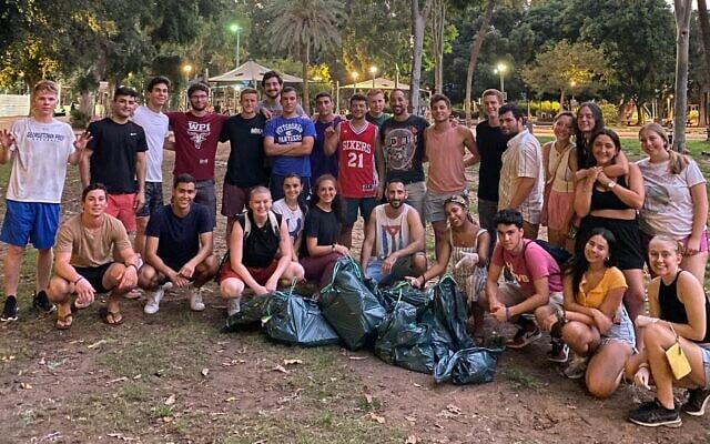 Volunteers at a Tuesdays for Trash cleanup event at a park in Tel Aviv, August 24, 2021. (Courtesy)