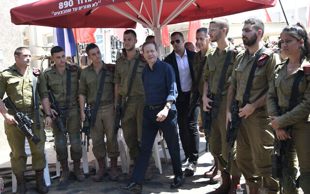 President Isaac Herzog meets with Israeli troops while touring the Gaza border in southern Israel on September 5, 2021. (Kobi Gideon/GPO) President Isaac Herzog meets with Israeli troops while touring the Gaza border in southern Israel on September 5, 2021. (Kobi Gideon/GPO)