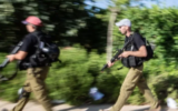 Illustrative: A local town's volunteer security squad simulates an attack. (Maor Kinsbursky/Flash90)