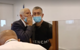 Michael Transky (R) appears at the Ashkelon Magistrate's Court on September 20, 2021. (Screen capture/YouTube)