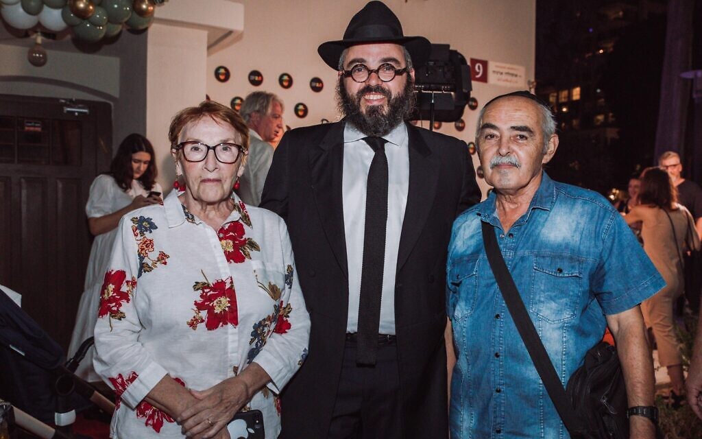 Rabbi Yosef Khersonsky, center, with his parents at the grand opening of the Jewish Point congregation's new synagogue building in Tel Aviv. It is the city's first synagogue geared specifically towards Russian speakers. (Courtesy)