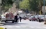 Police secure the area near a bank in Haifa where a woman threatened to detonate an explosive vest, on September 2, 2021. (Screenshot/Twitter)