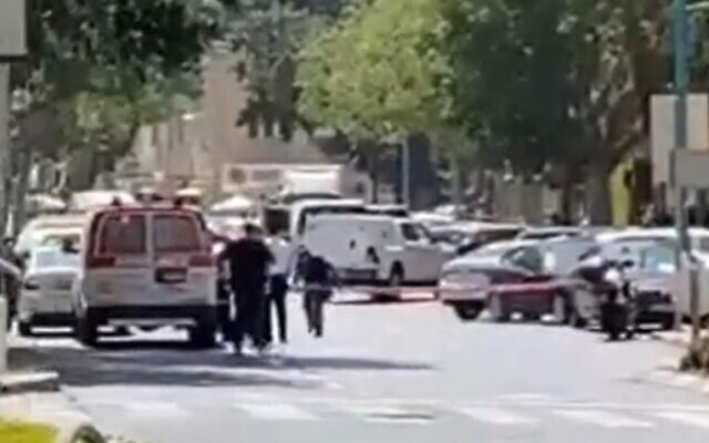 Police secure the area near a bank in Haifa where a woman threatened to detonate an explosive vest, on September 2, 2021. (Screenshot/Twitter)