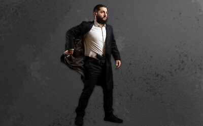 Rabbi Raziel Cohen demonstrates how to use the Tactical Kapota, a jacket designed for easily accessing a weapon. (Rabbi Raziel Cohen via JTA)