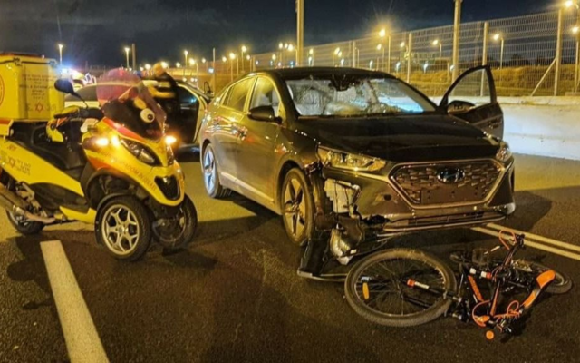 The scene where a 12-year-old boy was killed when he was hit by a car on Route 4 while riding on erev Yom Kippur, on September 15, 2021. (Magen David Adom) The scene where a 12-year-old boy was killed when he was hit by a car on Route 4 while riding on erev Yom Kippur, on September 15, 2021. (Magen David Adom)