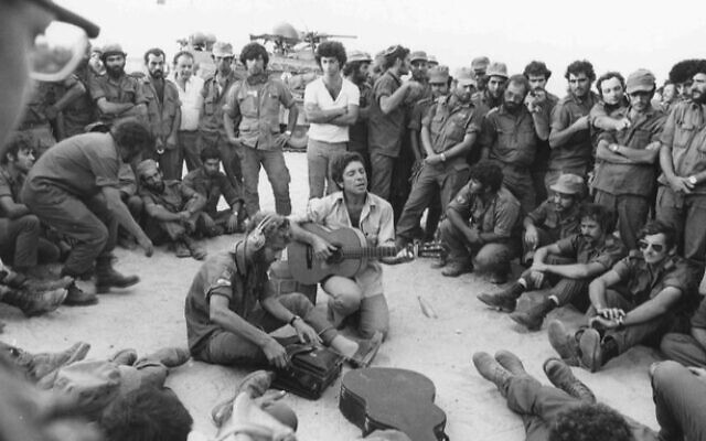 Leonard Cohen performs for Israeli troops in the Sinai during the 1973 Yom Kippur War (Ron Ilan/ IDF archives) Leonard Cohen performs for Israeli troops in the Sinai during the 1973 Yom Kippur War (Ron Ilan/ IDF archives)