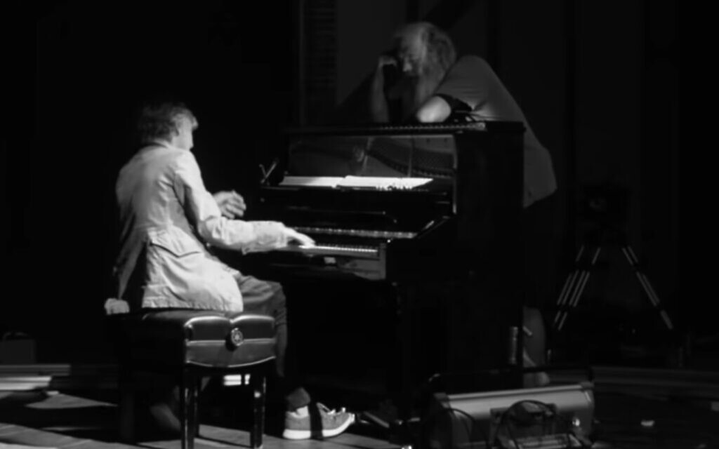 Paul McCartney, playing the piano for producer Rick Rubin, in 'McCartney 3,2,1.' (YouTube screenshot/ Hulu)