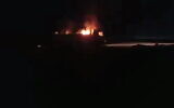 A burning vehicle is seen following a reported airstrike in the al-Bukamal region in Syria, near the border with Iraq, September 14, 2021. (Twitter/screenshot)