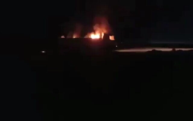 A burning vehicle is seen following a reported airstrike in the al-Bukamal region in Syria, near the border with Iraq, September 14, 2021. (Twitter/screenshot) A burning vehicle is seen following a reported airstrike in the al-Bukamal region in Syria, near the border with Iraq, September 14, 2021. (Twitter/screenshot)