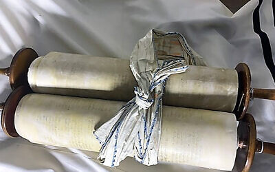 A Torah scroll that the Nazis stole from a Czech congregation on display at The Memorial Scrolls Trust in London. (Courtesy of the European Union for Progressive Judaism via JTA)