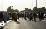 Protesters face-off with the police during an anti-Israel rally in Sitra island, south of the Bahraini capital, on October 1, 2021. (Mazen Mahdi / AFP)