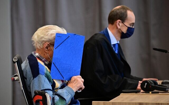 Defendant Josef S (L) sits next to his lawyer Stefan Waterkamp and hides his face behind a folder as he waits for the start of his trial in Brandenburg an der Havel, northeastern Germany, on October 7, 2021. (Tobias Schwarz / AFP) Defendant Josef S (L) sits next to his lawyer Stefan Waterkamp and hides his face behind a folder as he waits for the start of his trial in Brandenburg an der Havel, northeastern Germany, on October 7, 2021. (Tobias Schwarz / AFP)