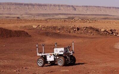 A robotic rover that is part of a team from Europe and Israel moves during a training mission for planet Mars at a site that simulates an off-site station at the Ramon Crater in Mitzpe Ramon in Israel's southern Negev desert on October 10, 2021.(Photo by JACK GUEZ / AFP)