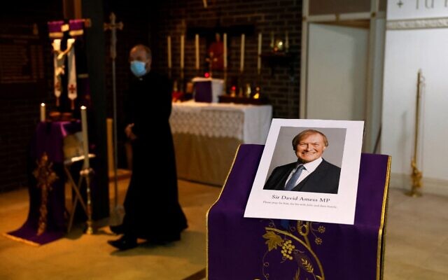A photograph of Conservative British lawmaker David Amess, who was fatally stabbed, is pictured prior to a service at Saint Peter's Catholic Parish of Eastwood in Leigh-on-Sea in southeast England on October 15, 2021 (Tolga Akmen / AFP) A photograph of Conservative British lawmaker David Amess, who was fatally stabbed, is pictured prior to a service at Saint Peter's Catholic Parish of Eastwood in Leigh-on-Sea in southeast England on October 15, 2021 (Tolga Akmen / AFP)