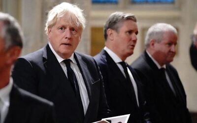 Britain's Prime Minister Boris Johnson (L), Britain's main opposition Labour Party leader Keir Starmer (C) and Scottish National Party (SNP) Westminster leader Ian Blackford attend a service of prayer and remembrance in honor of slain British lawmaker David Amess, at St Margaret's Church in London, October 18, 2021. (Jonathan Brady/ Pool/ AFP)