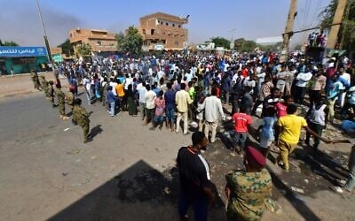 Sudanese security forces keep watch as they protect a military hospital and government offices during protests against a military coup that overthrew the transition to civilian rule, in the capital Khartoum's twin city of Omdurman, on October 25, 2021. (AFP)