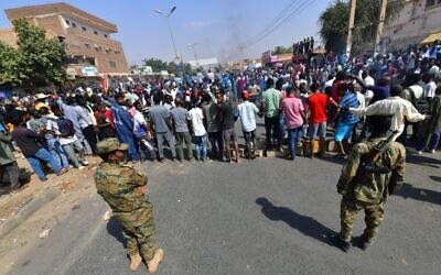Sudanese security forces keep watch during protests against a military coup that overthrew the transition to civilian rule, on October 25, 2021, in the capital Khartoum's twin city of Omdurman. (AFP)