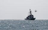 Ilustrative: A US Navy Martin UAV drone flies over the Gulf waters as the Royal Bahrain Naval Force (RBNF) Abdulrahman Al Fadhel takes part in a joint naval exercise between the US 5th Fleet Command and Bahraini forces, on October 26, 2021. (Mazen Mahdi/AFP)