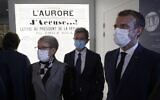French President Emmanuel Macron (R), flanked by president of the Maison Zola-Musee Dreyfus association Louis Gautier (C) and journalist Emile Zola's great-granddaughter's Martine Le Blond-Zola (L), visits the Dreyfus Museum, on the property of the Emile Zola house in Medan, near Paris, on October 26, 2021. (Ludovic MARIN / POOL / AFP)