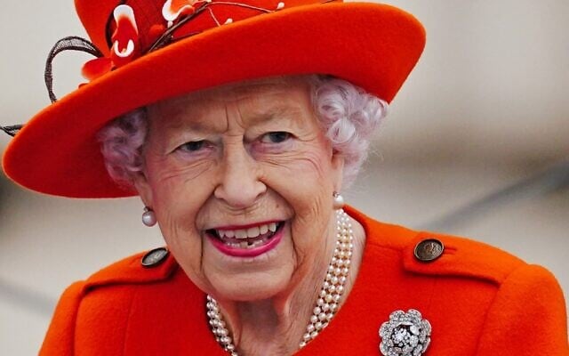 In this file photo from October 7, 2021, Britain's Queen Elizabeth II takes part in the launch of the Queen's Baton Relay for the Birmingham 2022 Commonwealth Games, from the forecourt of Buckingham Palace in London. (Victoria Jones/Pool/AFP)