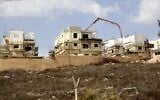 This file photo from October 13, 2021, shows construction in the Israeli settlement of Rahalim, located near the Palestinian village of Yatma, south of Nablus in the northern West Bank. (Jaafar Ashtiyeh/AFP)