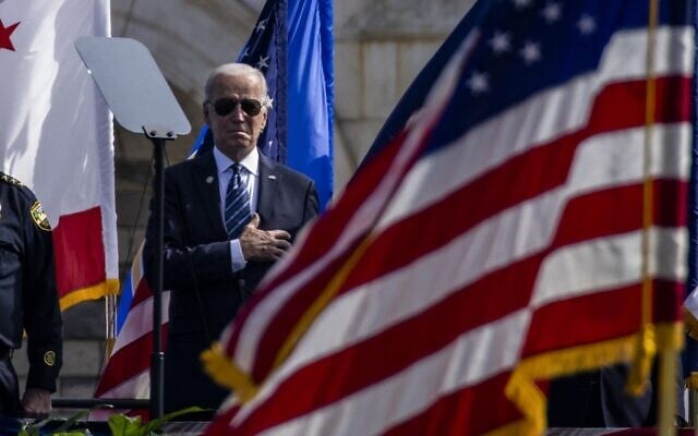 US President Joe Biden stands during the US National Anthem at the 40th Annual National Peace Officers Memorial Service on the West Front of the US Capitol Building, on October 16, 2020, in Washington, DC. (Samuel Corum/Getty Images/AFP) US President Joe Biden stands during the US National Anthem at the 40th Annual National Peace Officers Memorial Service on the West Front of the US Capitol Building, on October 16, 2020, in Washington, DC. (Samuel Corum/Getty Images/AFP)
