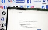 Facebook's logo is displayed next to a screen showing that the Facebook website is down, on October 4, 2021, in San Anselmo, California. (JUSTIN SULLIVAN / GETTY IMAGES NORTH AMERICA / Getty Images via AFP)