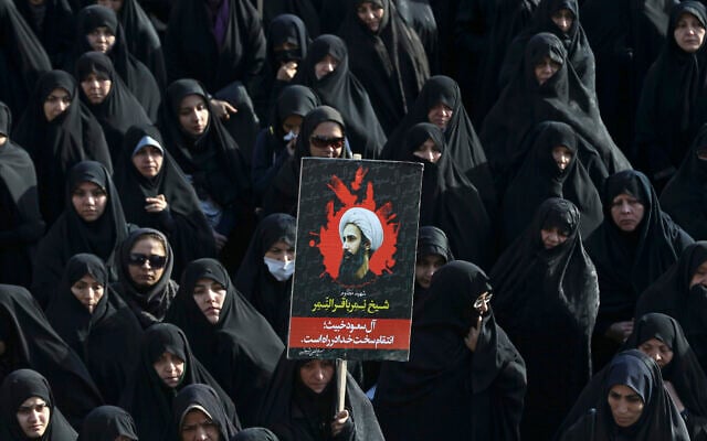 An Iranian woman holds up a poster showing Sheikh Nimr al-Nimr, a prominent opposition Saudi Shiite cleric who was executed by Saudi Arabia, in Tehran, Iran, during a protest on January 4, 2016. (AP Photo/Vahid Salemi) An Iranian woman holds up a poster showing Sheikh Nimr al-Nimr, a prominent opposition Saudi Shiite cleric who was executed by Saudi Arabia, in Tehran, Iran, during a protest on January 4, 2016. (AP Photo/Vahid Salemi)