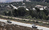 Illustrative:  Sept. 2, 2019, file photo, Spanish UN peacekeepers patrol along the Lebanese-Israeli border, with the Israeli village of Metulla in the background. (AP/Hussein Malla)