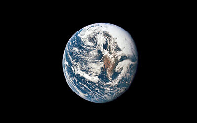 Earth from 36,000 nautical miles away as photographed from the Apollo 10 spacecraft during its trans-lunar journey toward the moon, May 18, 1969. (NASA via AP)