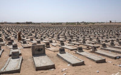 A man walks in a mass graveyard where hundreds of Yemeni fighters are buried in Marib, Yemen, June 21, 2021. (AP Photo/ Nariman El-Mofty) A man walks in a mass graveyard where hundreds of Yemeni fighters are buried in Marib, Yemen, June 21, 2021. (AP Photo/ Nariman El-Mofty)