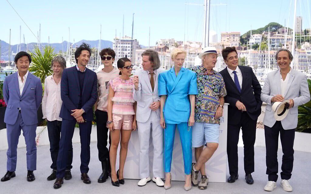 Steve Park, from left, Mathieu Amalric, Adrien Brody, Timothee Chalamet, Lyna Khoudri, director Wes Anderson, Tilda Swinton, Bill Murray, Benicio Del Toro, and Alexandre Desplat pose for photographers at the photo call for the film 'The French Dispatch' at the 74th international film festival, Cannes, southern France, July 13, 2021. (AP Photo/Brynn Anderson)