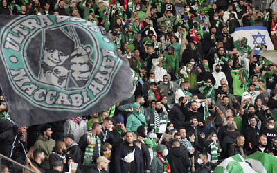 Supporters of Maccabi Haifa attend a group E Europa Conference League soccer match between FC Union Berlin and Maccabi Haifa FC in Berlin, Germany, September 30, 2021. (Michael Sohn/AP)