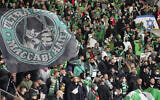 Supporters of Haifa attend a group E Europa Conference League soccer match between 1. FC Union Berlin and Maccabi Haifa FC in Berlin, Germany, Sept. 30, 2021. (AP Photo/Michael Sohn)