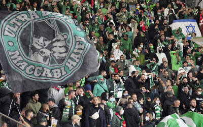 Supporters of Haifa attend a group E Europa Conference League soccer match between 1. FC Union Berlin and Maccabi Haifa FC in Berlin, Germany, Sept. 30, 2021. (AP Photo/Michael Sohn)