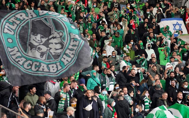 Supporters of Haifa attend a group E Europa Conference League soccer match between 1. FC Union Berlin and Maccabi Haifa FC in Berlin, Germany, Sept. 30, 2021. (AP Photo/Michael Sohn) Supporters of Haifa attend a group E Europa Conference League soccer match between 1. FC Union Berlin and Maccabi Haifa FC in Berlin, Germany, Sept. 30, 2021. (AP Photo/Michael Sohn)