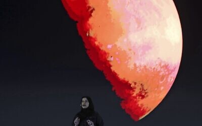 Sarah Al Amiri, Emirati Minister of State for Advanced Sciences and Deputy Project Manager of the Emirates Mars Mission speaks ahead of a live broadcast of the Hope Probe as it attempts to enter Mars orbit as a part of Emirates Mars mission, in Dubai, United Arab Emirates, February 9, 2021. (AP Photo/Kamran Jebreili, File)