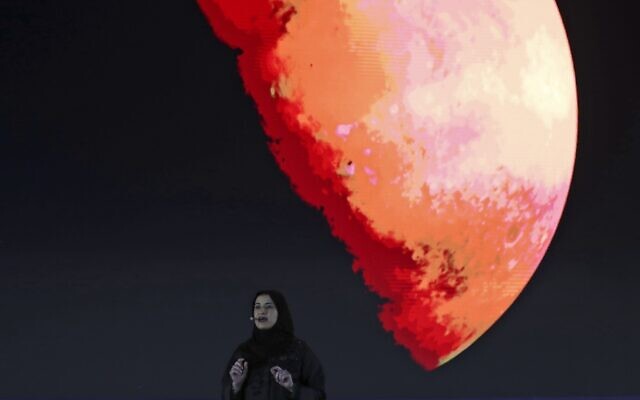 In this photo from February 9, 2021, Sarah Al Amiri, Emirati Minister of State for Advanced Sciences and Deputy Project Manager of the Emirates Mars Mission speaks ahead of a live broadcast of the Hope Probe as it attempts to enter Mars orbit as a part of Emirates Mars mission, in Dubai, United Arab Emirates, October 5, 2021. (AP Photo/Kamran Jebreili, File)